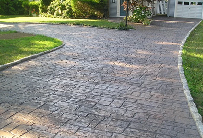 Old styled concrete driveway stamped and colored.