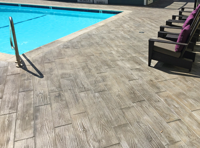 Wood plank style pool deck in Stamford.