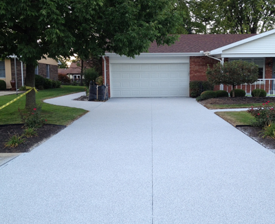 Plain textured concrete driveway.