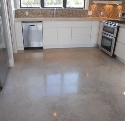 Kitchen concrete floor stained and polished.