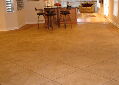 Concrete dining room floor cut into perfect squares.