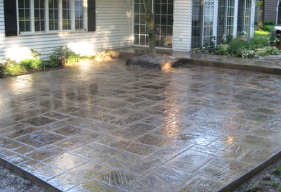 Polished concrete patio stamped in a tile design.
