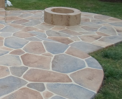 Decorative concrete patio with built in fire pit in Stamford.