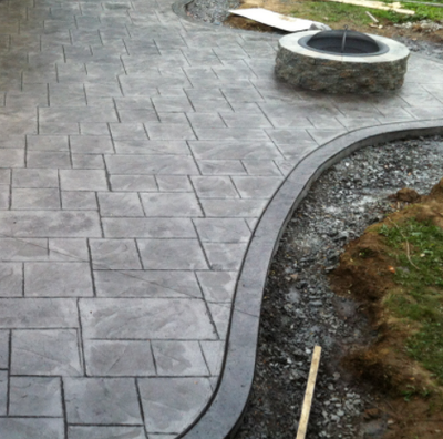 Stamped concrete patio with built in fire pit.
